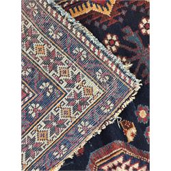 Persian Heriz wool rug, red and ivory field with floral medallion, geometric spandrels, and floral border (157cm x 107cm); Kurdish Shairwan wool rug, red and navy field with three medallions, geometric crosses and serrated border (200cm x 155cm); Persian Qashqai wool rug, golden-yellow field with boteh motifs and wide floral border (127cm x 82cm)