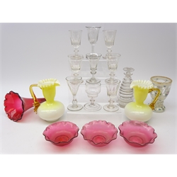  19th century Beehive glass decanter with mushroom stopper, H19cm, collection of 19th century drinking glasses,  Bohemian milk glass overlay vase with hand painted roses, pair Vaseline glass jugs with frill rim and amber glass handles, cranberry trumpet bowl and three small cranberry glass bowls (17)  