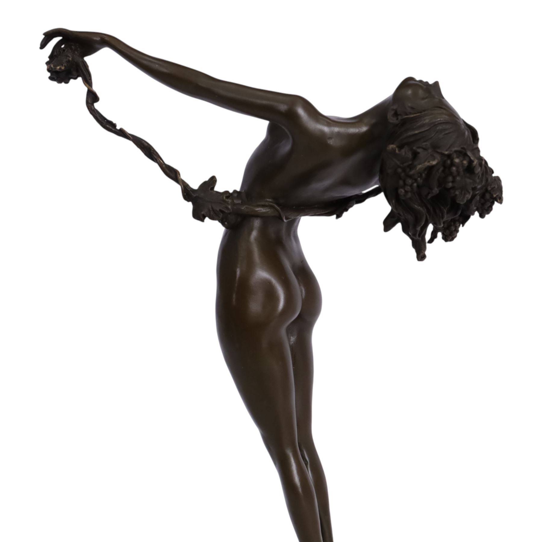 After H Fishmuth; Bronze figure of a nude female holding a vine, with foundry mark on socle base, H38cm