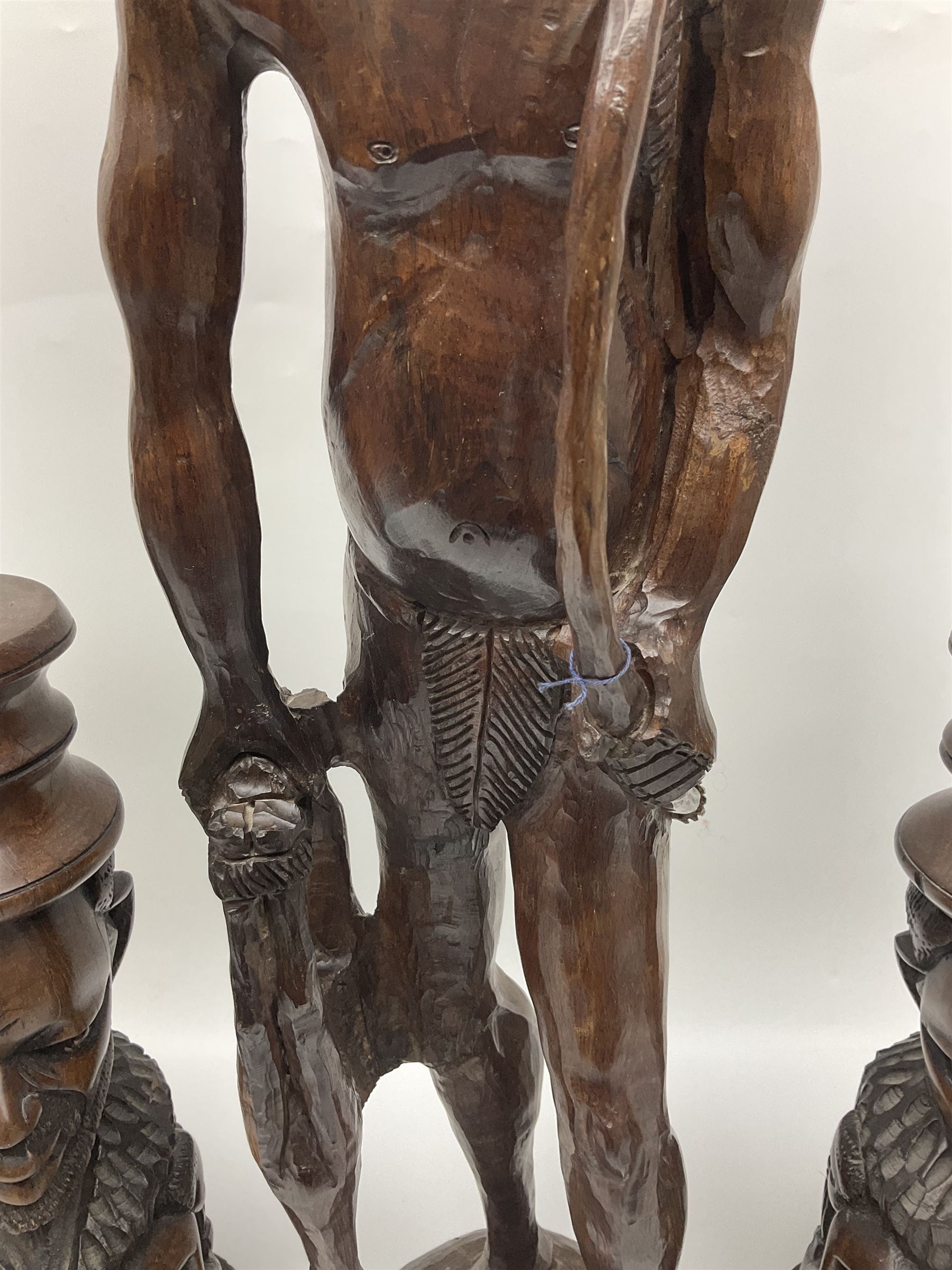 Pair of 20th century carved wood table lamp with African busts and figures, together with a carved wooden figure and soapstone figure, lamps H44cm
