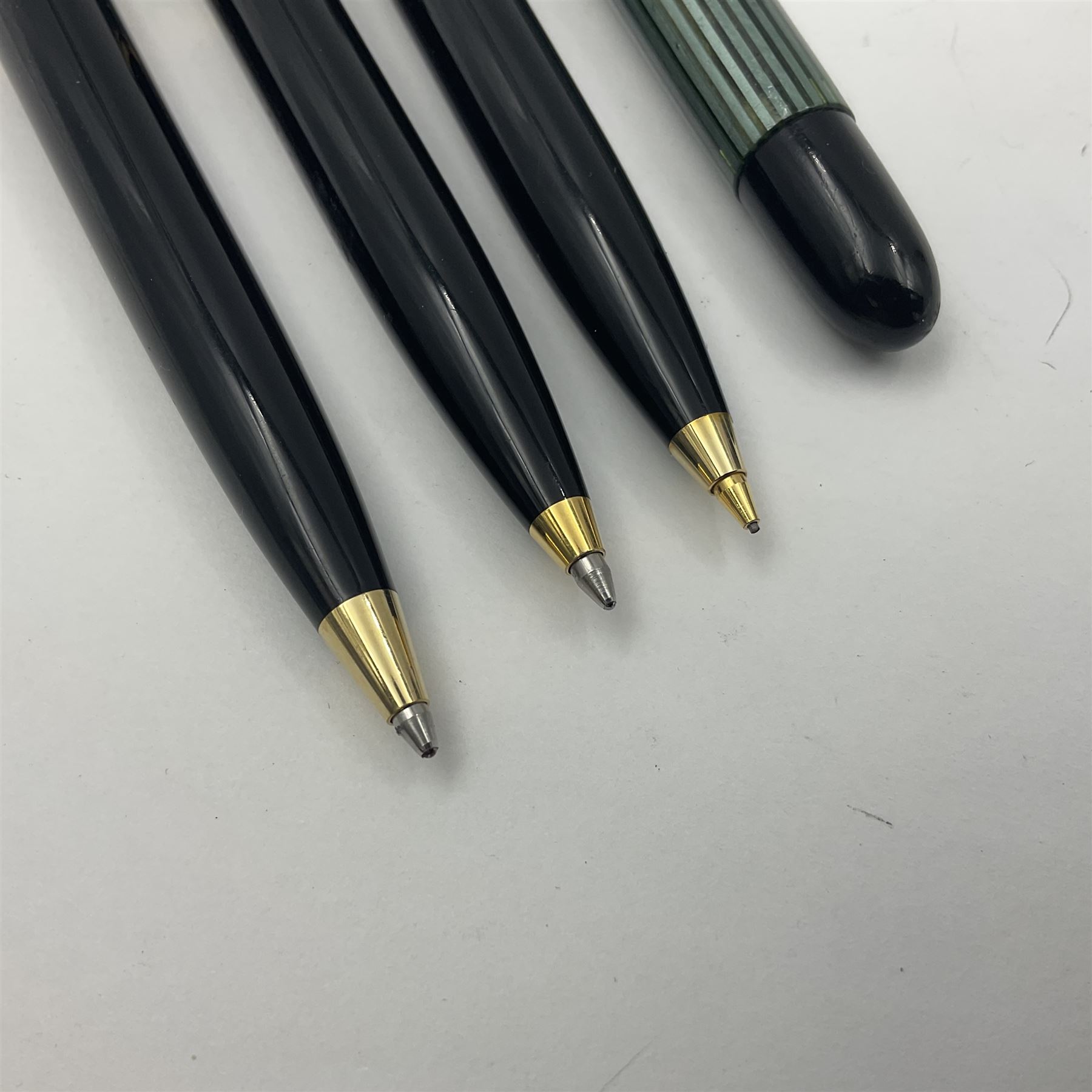 Pelikan Souveran 140 fountain pen, the green and black striped barrel with gold plated beak shaped clip and bands, with gold nib stamped 14C-585, together with matching twist ballpoint pen, push ballpoint pen and propelling pencil, largest approx L13.5cm (4)