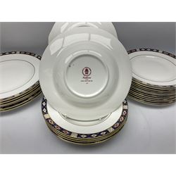 Royal Crown Derby dinner and tea wares decorated in the Kedleston pattern, comprising six dinner plates, twelve dessert plates, six side plates, six soup bowls, twelve fruit dishes, bread and butter plate, oval serving plate, oval serving dish, sauce boat and stand, cream jug, and two open sucriers 