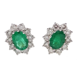  Pair of 18ct gold emerald and diamond cluster stud earrings, hallmarked, total emerald weight approx 1.9 carat, total diamond weight approx 1 carat  
