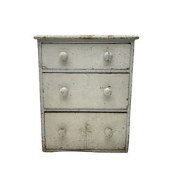 Early 20th century white painted pine bedside chest, fitted with three drawers