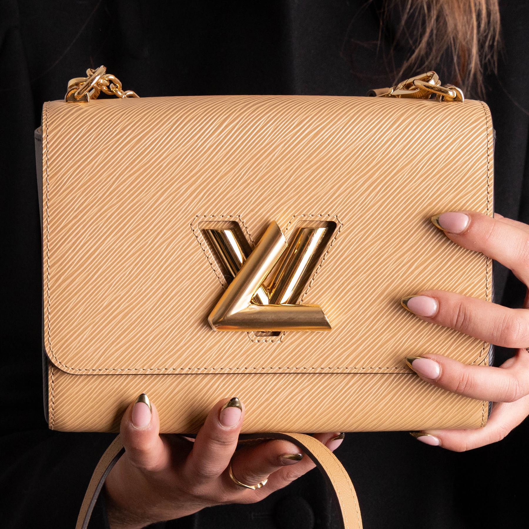 Louis Vuitton - ‘Twist’ MM Bag, the model introduced for the Cruise 2015 collection under Nicolas Ghesquière, in structured beige Epi cow hide leather with black sides, with gold-tone signature LV monogram twist-lock fastening and chain carrying handle, with detachable flat leather shoulder or crossbody strap, unused with original box and dust bag
