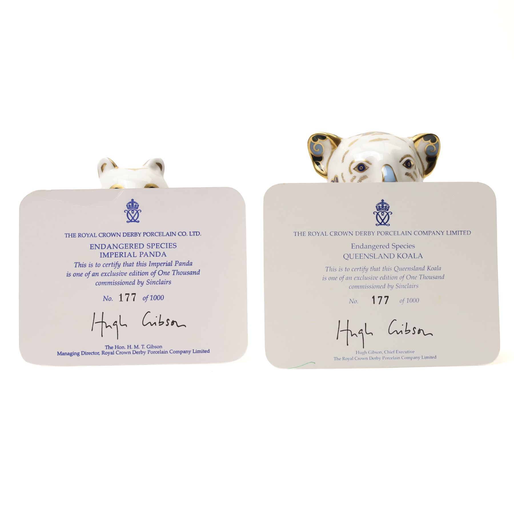 Royal Crown Derby paperweights, Queensland Koala  limited edition 177/1000 with gold stopper and Imperial Panda 177/1000 with silver stopper, both with certificates and from the Endangered Species series