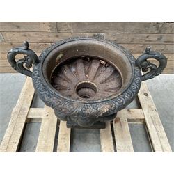 Victorian design ornate cast iron centrepiece urn, featuring two handles, raised on footed base
