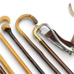 Collection of modern walking sticks, ebonised evening canes, thumb stick and shooting stick etc 