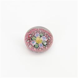 Nine miniature milleifiori paperweights including an example with twisted canes 