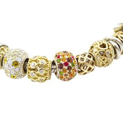 Chamilia 14ct gold and silver charm bracelet, silver bracelet, with 14ct gold and silver finials, six 14ct gold charms including cubic zirconia, four silver charms and two silver and 14ctgold charms, boxed