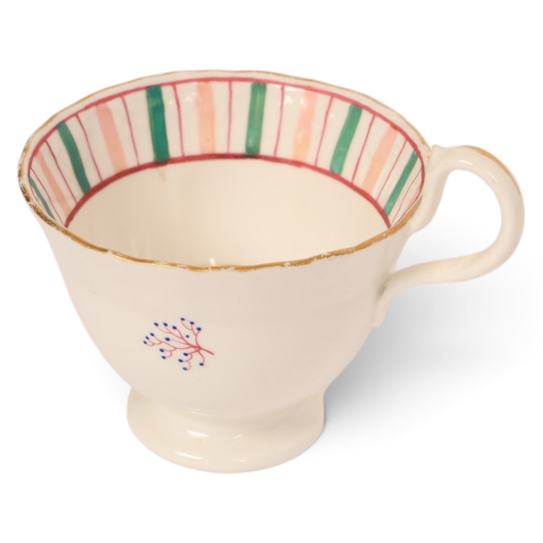 Late 19th century tea service, decorated with a green and pink strips, with internal decoration of budding branch within a gilt band upon a white glazed ground, comprising  twin handle lidded sucrier, milk jug, three serving plates, nine cups and saucers and four teacups