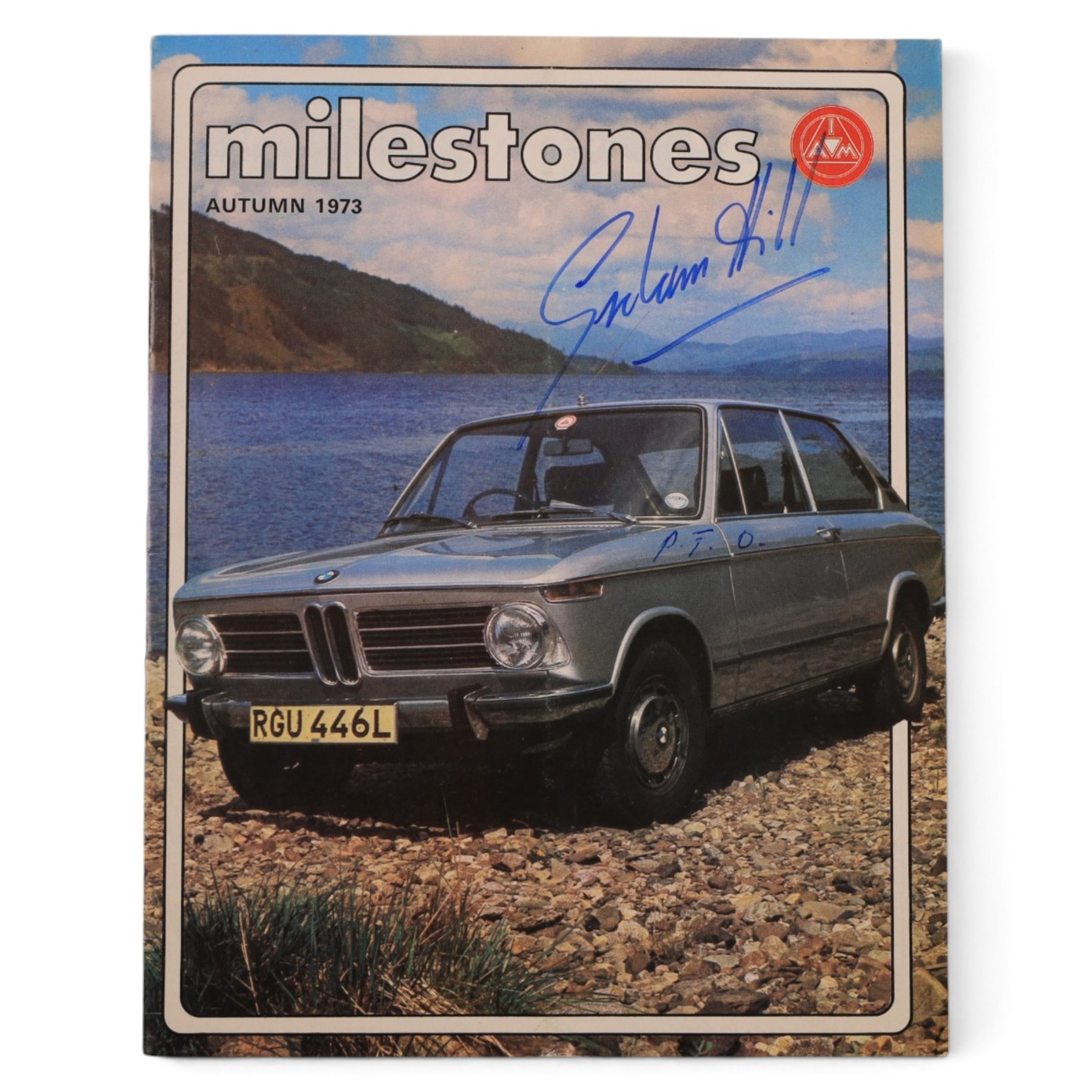 Signed Formula 1 memorabilia, including 1973 Milestones magazine signed to the front cover by Graham Hill and three signed photographs comprising Jackie Stewart, Jack Bradbury and Mario Andretti, with certificate of authenticity from Chaucer Auctions