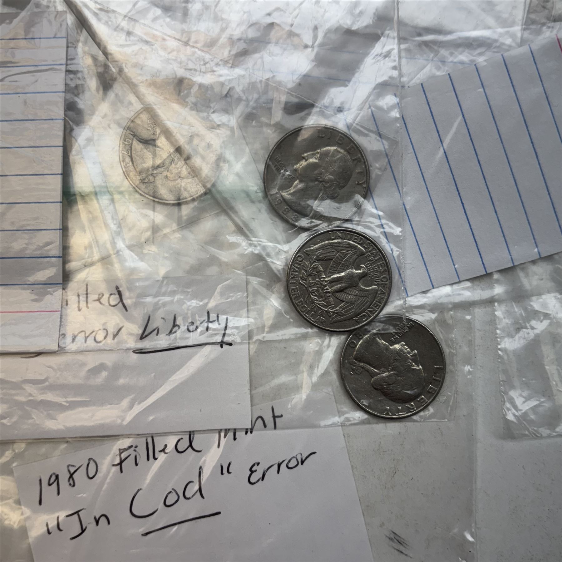Collection of United States of America coins, 1965 onwards, principally quarter dollars, many with alleged minting errors as annotated on labels