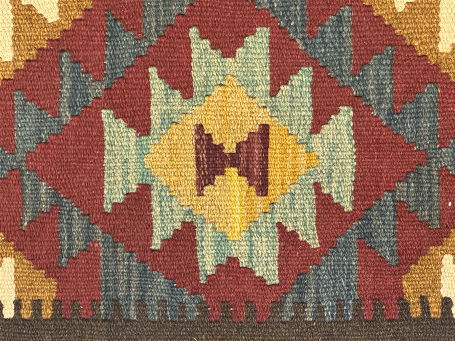 Maimana Kilim ground runner, multicoloured geometric medallions arranged in rows, with triangular motifs in the field, the wide border in brown with contrasting guard bands