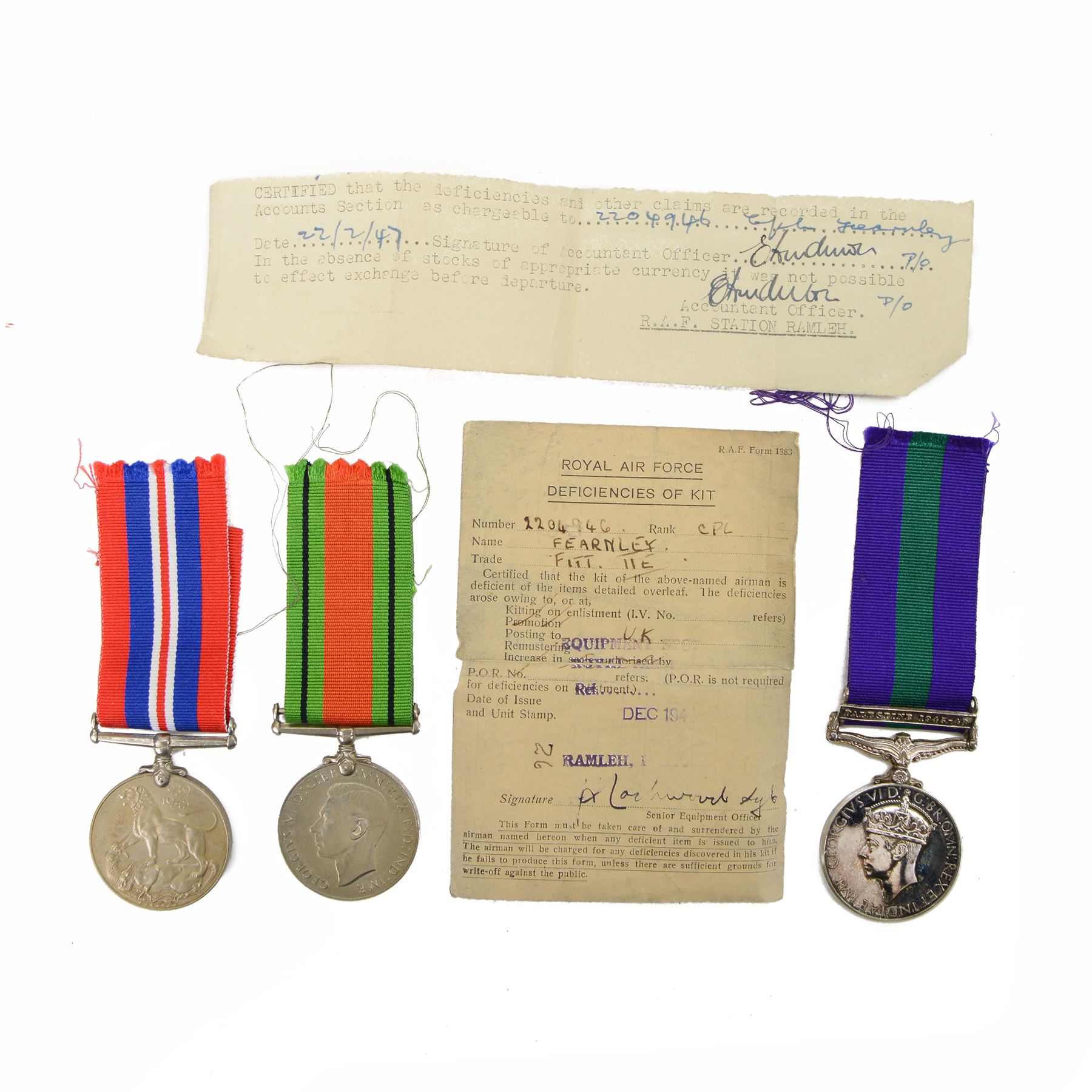 WWII pair of war medals comprising 1939-1945 War Medal and Defence Medal together with General Service Palestine medal with 1945-1958 clasp, awarded to LAC E Fearnley 2204946 Royal Air Force