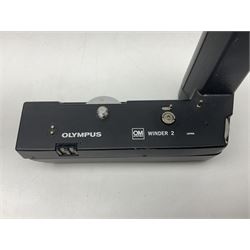 Olympus OM-1 camera body, serial no 913212, with 'Olympus OM-System F.Zuiko Auto-S 1:1.8 f=50mm' lens, serial no.74374, 'Vivitar wide angle MC 28mm 1:2.8 49mm' lens, serial no. 42042268, and Olympus OM winder 2