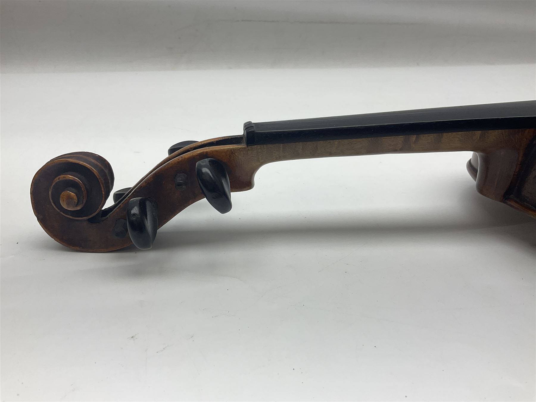 Late 19th century German trade violin c1890 with 36cm two-piece birds-eye maple back, neck and ribs and spruce top; bears label 'Manufactured in Berlin Special Copy of Nicolaus Amati' L59.5cm; in carrying case