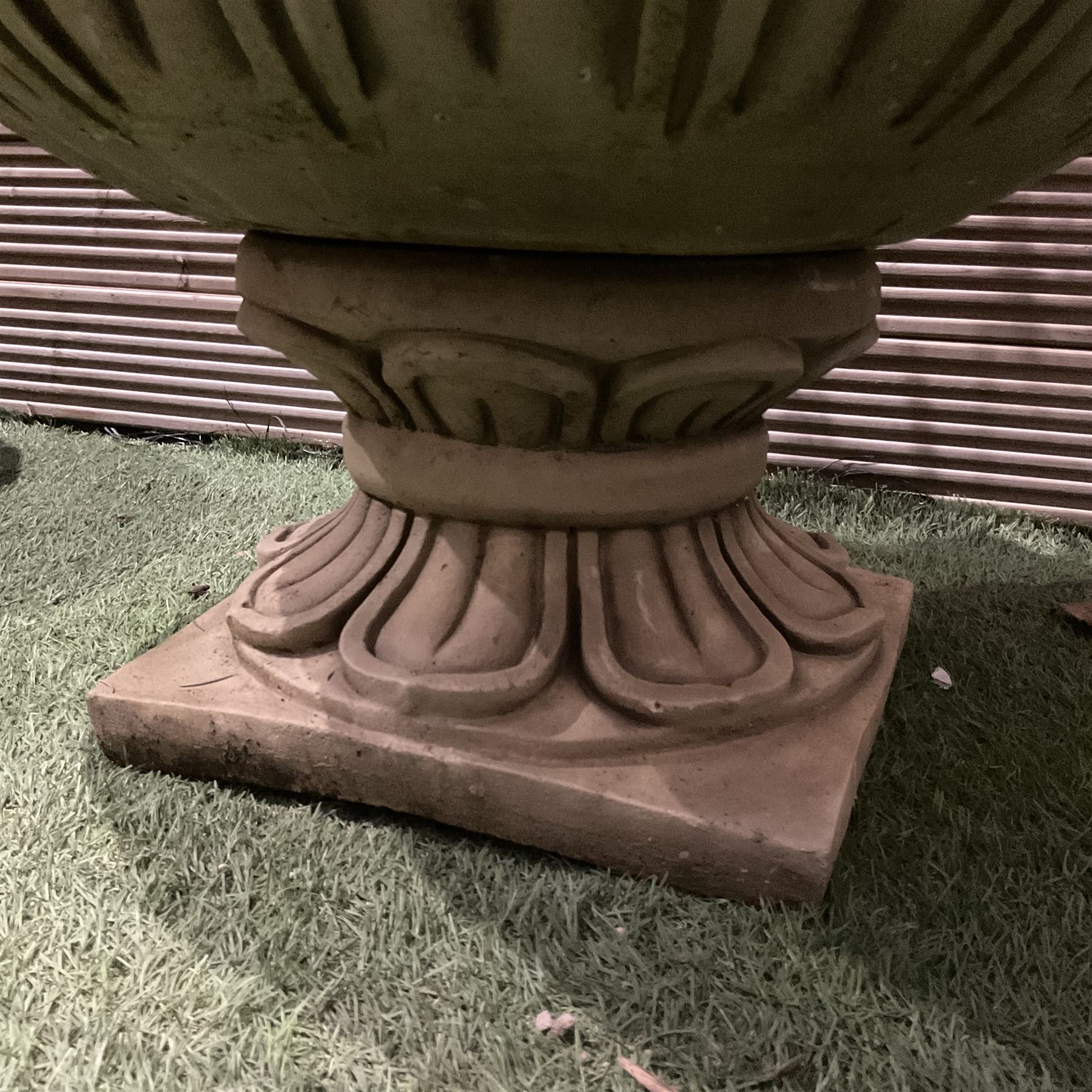 Pair of large decorated cast stone planters on plinths  - THIS LOT IS TO BE COLLECTED BY APPOINTMENT FROM DUGGLEBY STORAGE, GREAT HILL, EASTFIELD, SCARBOROUGH, YO11 3TX