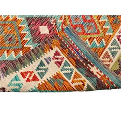 Anatolian Turkish Kilim multi-colour rug, decorated with all over lozenges in contrasting colours with ivory outline, the multi-band ivory border with repeating geometric shapes and small lozenges or diamonds