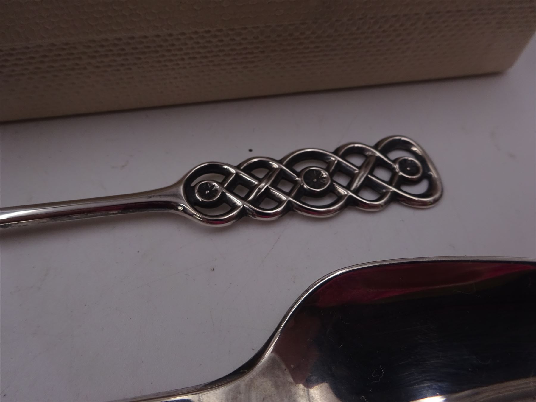 Mid 20th century Norwegian silver Christening spoon and fork set with openwork lattice detail to finials, both stamped David Anderson 830S verso, in original box, together with three silver-gilt enamel coffee spoons, the larger example with green guilloche enamel to bowl and handle, all by David Anderson, stamped D-A 925S Norway Sterling verso