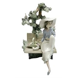 Lladro figure, Sunday in the Park, modelled as a woman sat on a bench under a tree, sculpted by Antonio Ramos, no 5365, year issued 1986, year retired 1986, H22cm