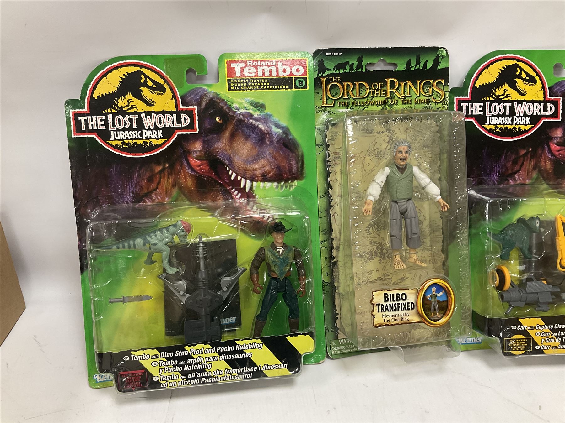 Fourteen carded action figures comprising Toy Story, X-Men Marvel Legends, Lord of the Rings, The Lost World Jurassic Park (2), The Secret Saturdays, Wallace & Gromit, Corgi Tom & Jerry (4), Flintstones, Lost in Space and Disney Infinity Cars; all in unopened blister packs; together with two boxed Robocop figures and carded James Bond car (17)