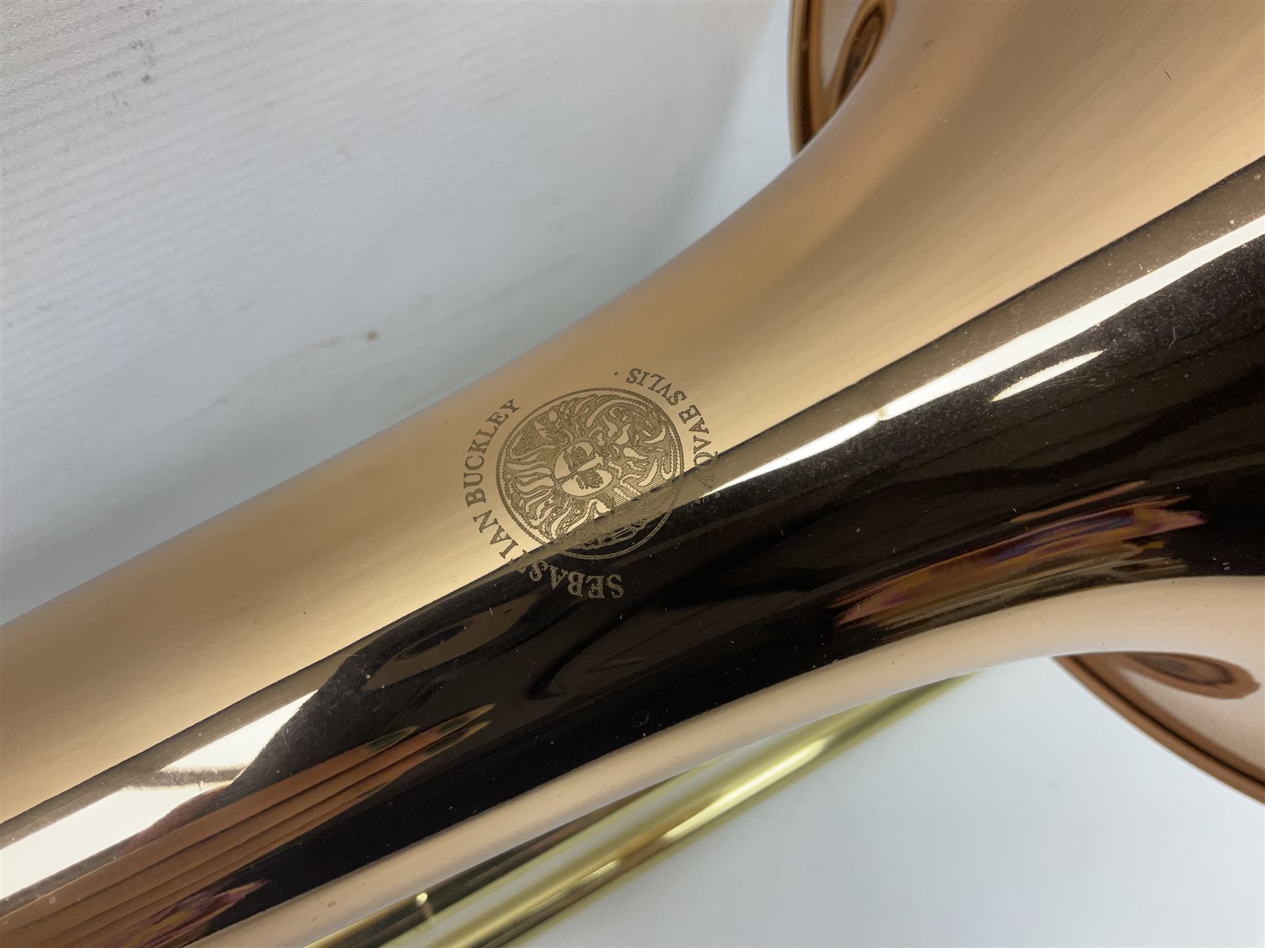 Sebastian Bucklet Aquae Sulis copper and brass trombone No.0910004; in lightweight carrying case; and Kinsman folding tubular chrome music stand in case (2)