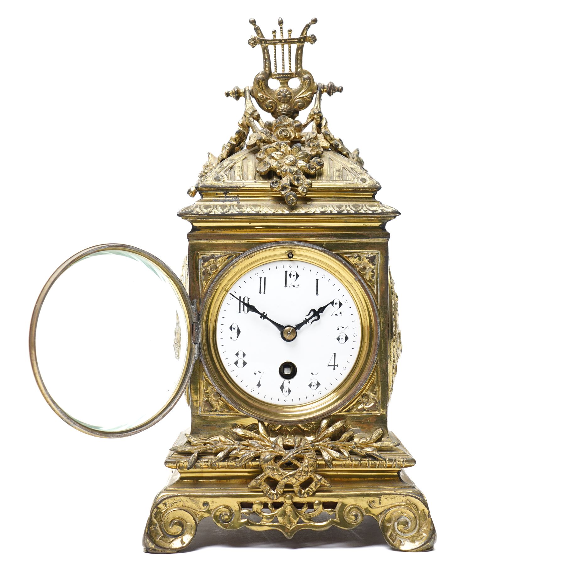 Early 20th century mantel clock with white enamel dial, French timepiece movement and recoil anchor escapement in brass case with lyre finial, trailing garlands and wreaths etc on scroll feet H30cm 
Provenance: property of a Nobleman