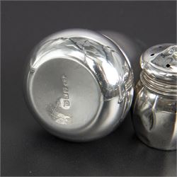 Group of silver cruets, including a pair of Edwardian conical shaped salt and pepper shakers and four other salt/pepper shakers, all hallmarked 