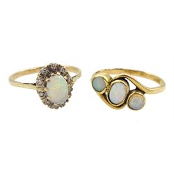 Gold three stone opal ring, stamped 18ct and a 9ct gold opal and diamond cluster ring