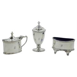 George V silver condiment set, comprising open salt, mustard pot and cover, and pepper, each of oval form with engraved initial, open salt and mustard with blue glass liners, hallmarked Haseler Brothers, Chester 1915 and 1916, approximate total silver weight 4.5 ozt (140 grams)