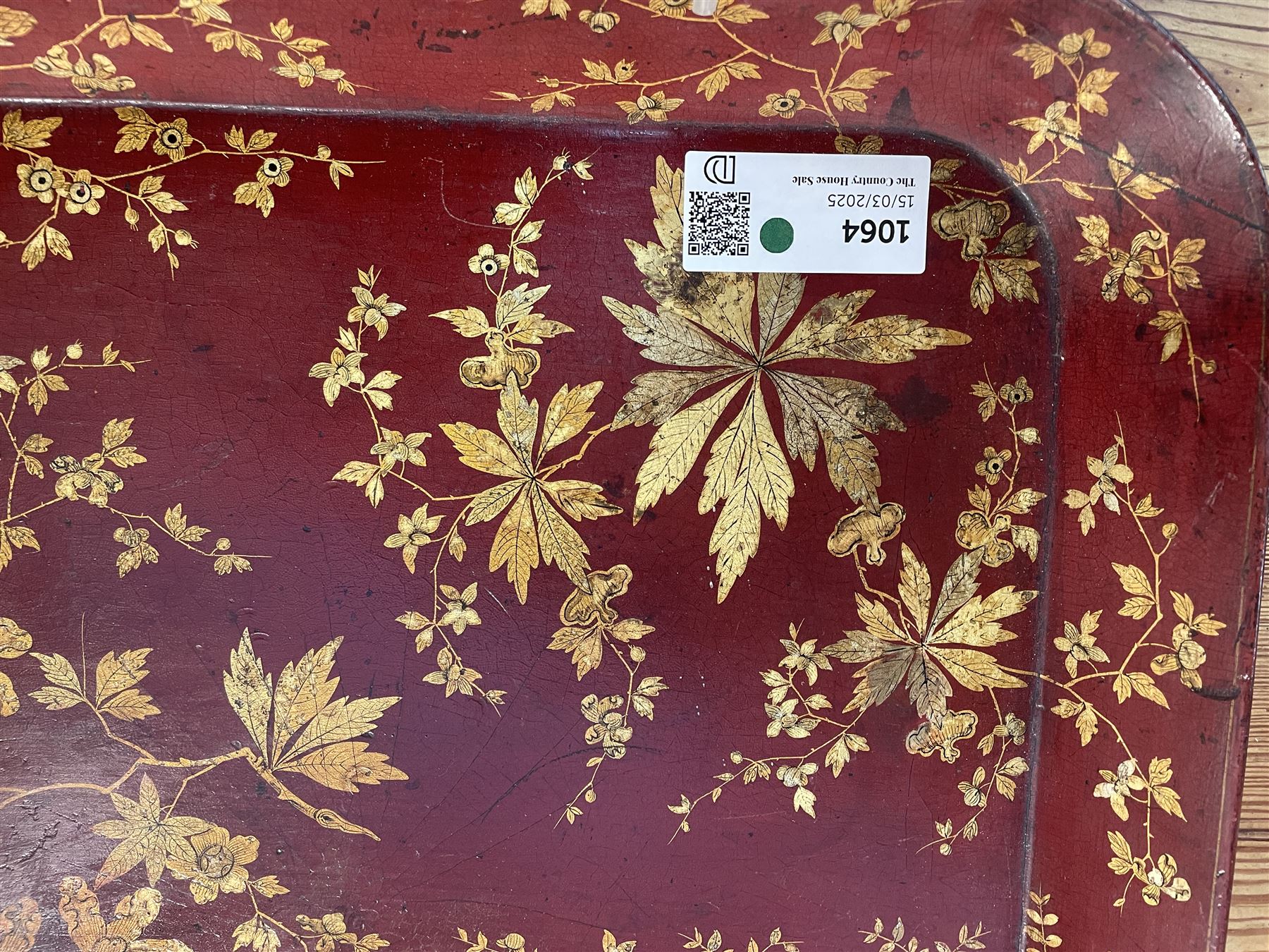 Early 19th century red lacquered papier-mâché tray by Clay of King Street Covent Garden, of rounded rectangular form, painted in gilt with large foliate sprays and butterflies, impressed verso CLAY KING ST COVENT GARDEN, W66.5cm D48.5cm