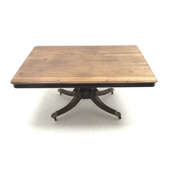 Regency mahogany breakfast table, rectangular moulded tilt top with rounded corners, turned and carved pedestal with four out splayed moulded supports with brass hairy paw castors, 112cm x 157cm, H73cm