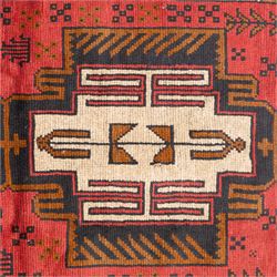 Turkish Anatolian rug, crimson ground, with stepped geometric medallions in ivory, brown, and black within angular striped borders in tones of red and ochre 