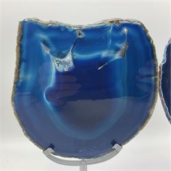 Pair of blue agate slices, polished with rough edges, raised upon silvered metal stands, H26cm