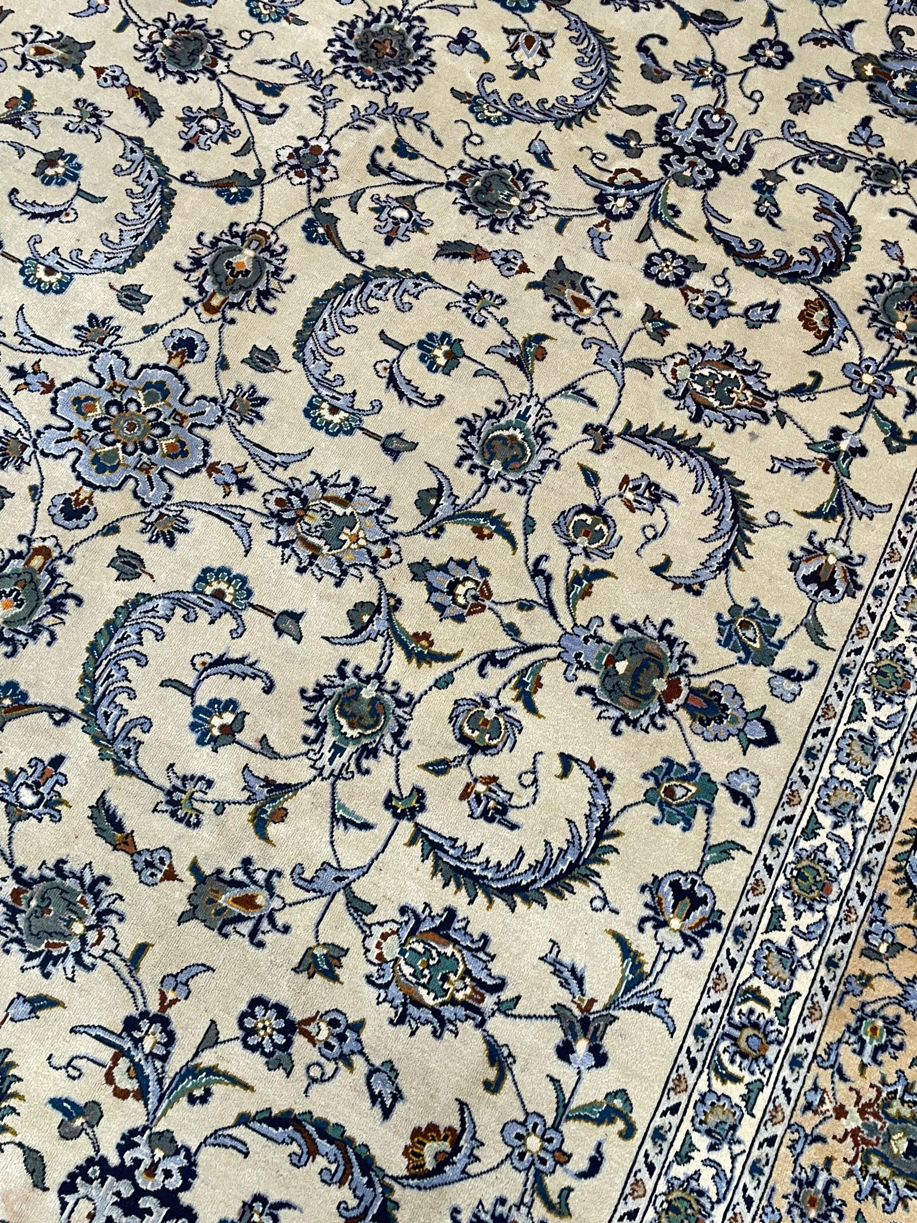Persian Nain pale sage ground carpet, decorated with curled leaf motifs and palmettes, the busy borders decorated densely with similar design, within floral pattern guard stripes 