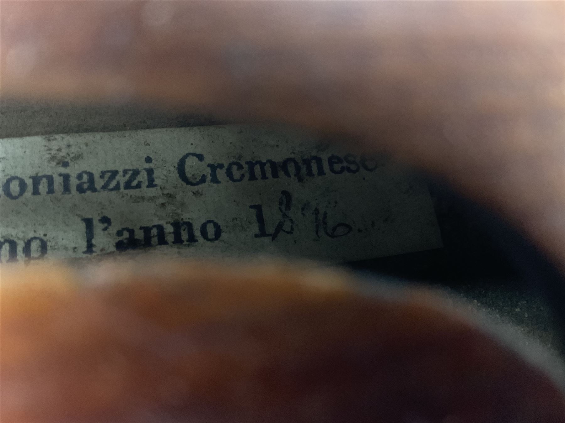 Mid-19th century German violin with 36cm two-piece maple back and ribs and spruce top, bears label 'Riccardo Antoniazzi Cremonese fece in Milano l'anno 1896' L59.5cm overall; in walnut case with two part bows