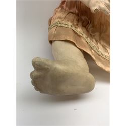 German bisque head doll with applied hair, sleeping eyes and open mouth with teeth and fixed tongue, on composition body with jointed limbs, marked 'P.M. 914 Germany 14' H65cm