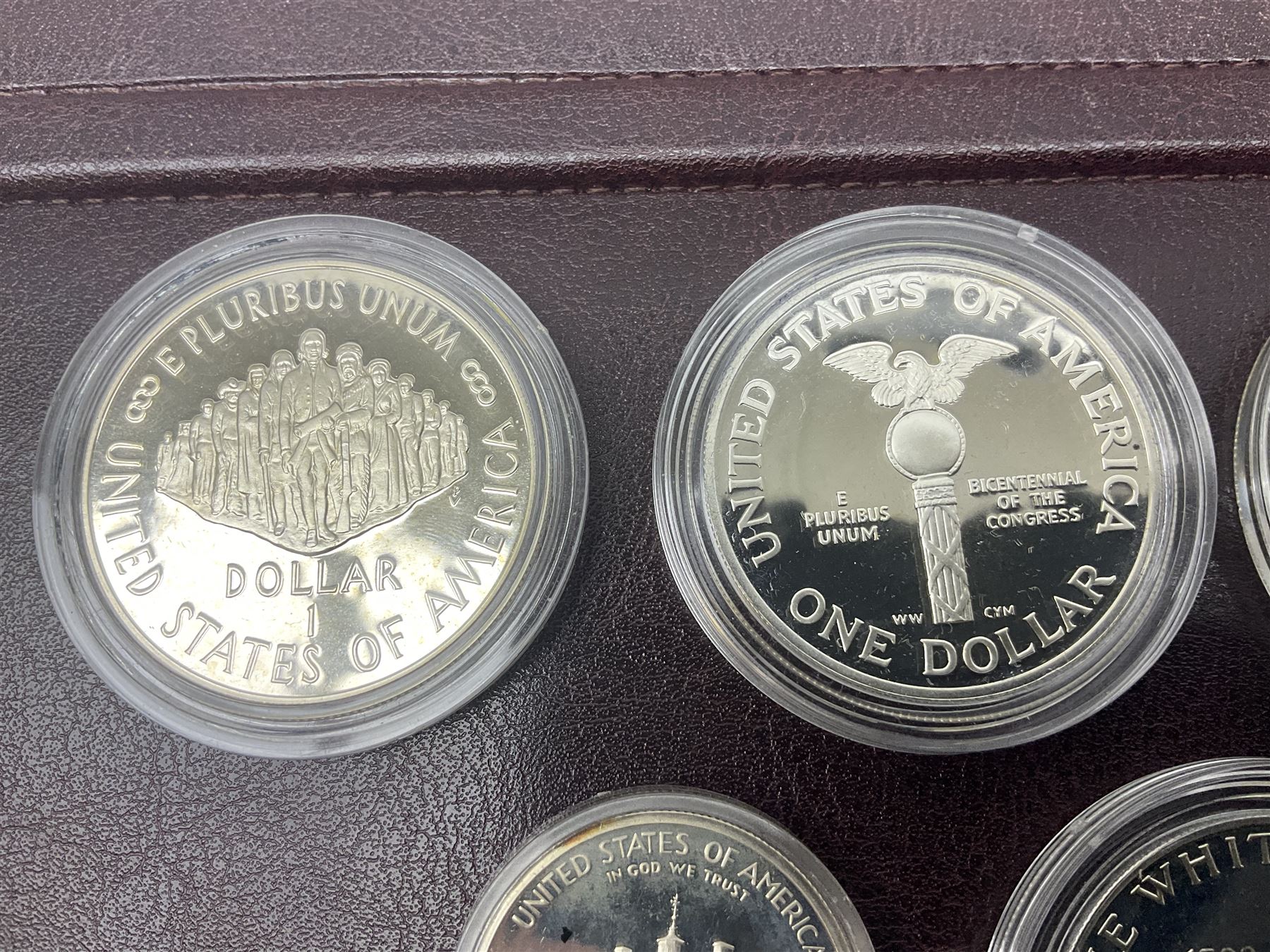 Five United States of America commemorative silver proof coins, comprising 1986, 1987, 1989, 1992 one dollars and 1982 half dollar, all with certificates