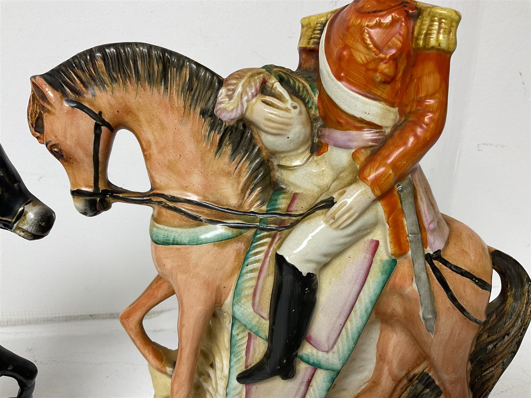 Staffordshire figure of the Duke of Wellington on a bay horse, H30cm in red uniform, together with a similar Staffordshire figure of Dick Turpin, pair of Staffordshire style dogs, H27cm, three Meissen style double salts and two trinket boxes 