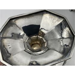 Victorian silver four piece tea service, comprising teapot, teapot stand, twin handled open sucrier and milk jug, each of octagonal form with foliate bud border and engraved decoration including crest to canted panels, and vacant panels, the teapot with ivory finial to the hinged cover and later wooden handle, hallmarked Edward Barnard & Sons Ltd, London1896, teapot including finial H15cm, milk jug including handle H16cm, teapot stand W11.5cm

This item has been registered for sale under Section 10 of the APHA Ivory Act