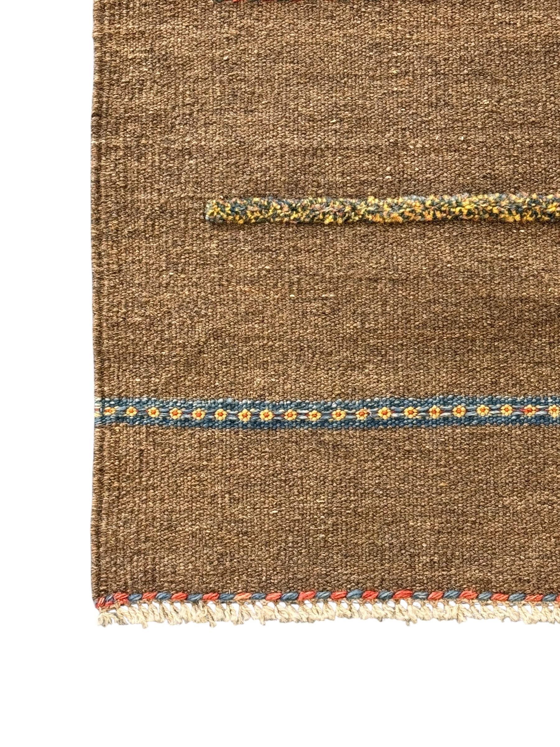 Shiraz Kilim rug, decorated with multi-coloured and patterned horizontal lines 