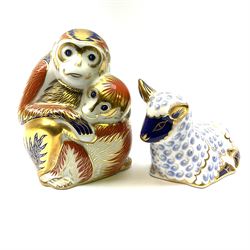 Royal Crown Derby Monkey and Baby paperweight H9.5cm, together with a Royal Crown Derby lamb paperweight H6cm both with gold stoppers. 
