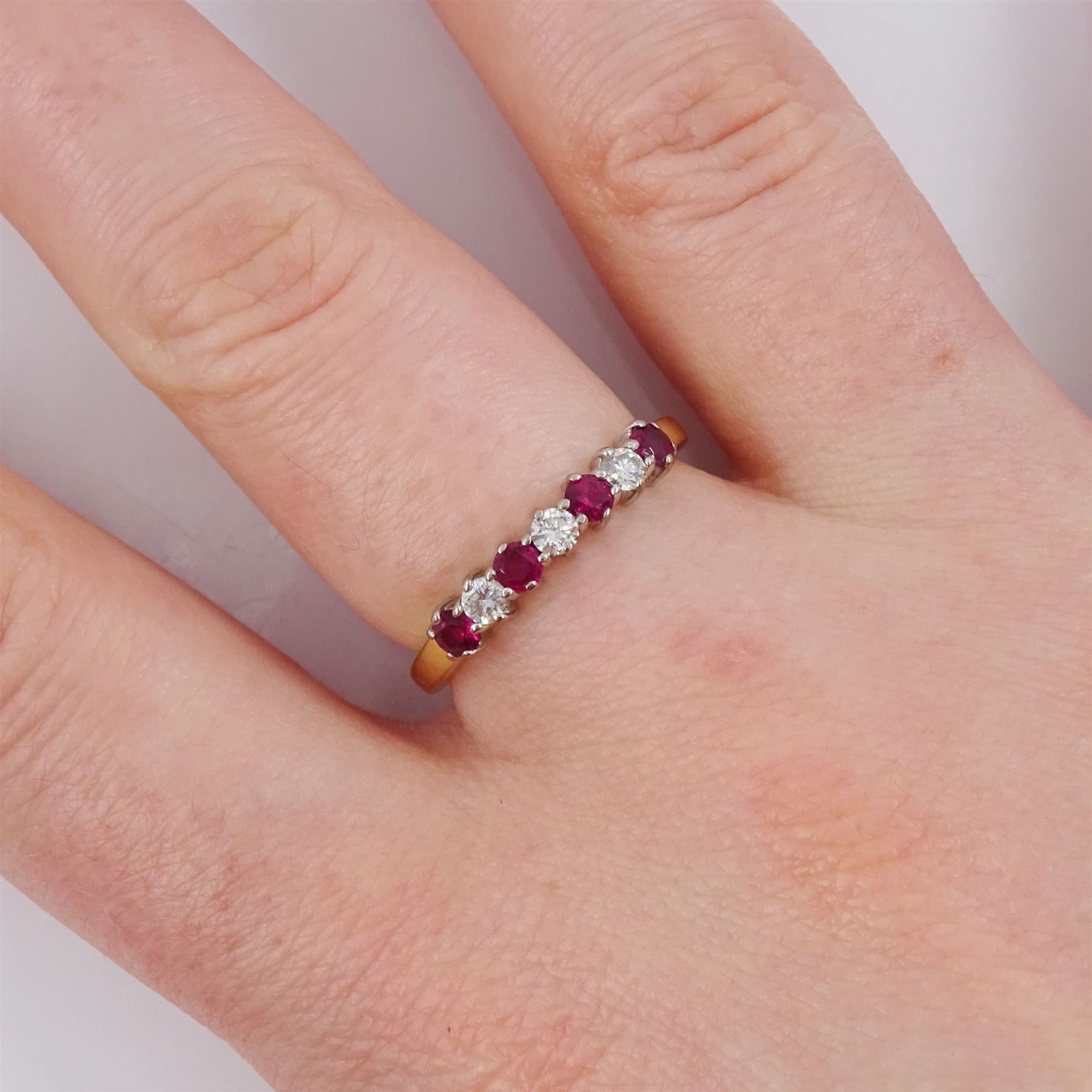18ct gold seven stone ruby and round brilliant cut diamond half eternity ring, London 2006