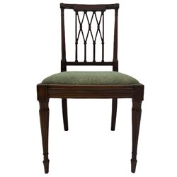 Pair late 19th century mahogany side chairs, the inlaid and reed carved cresting rail over lattice back, the turned uprights with carved foliage capitals, upholstered drop in seat, lobe carved and turned supports