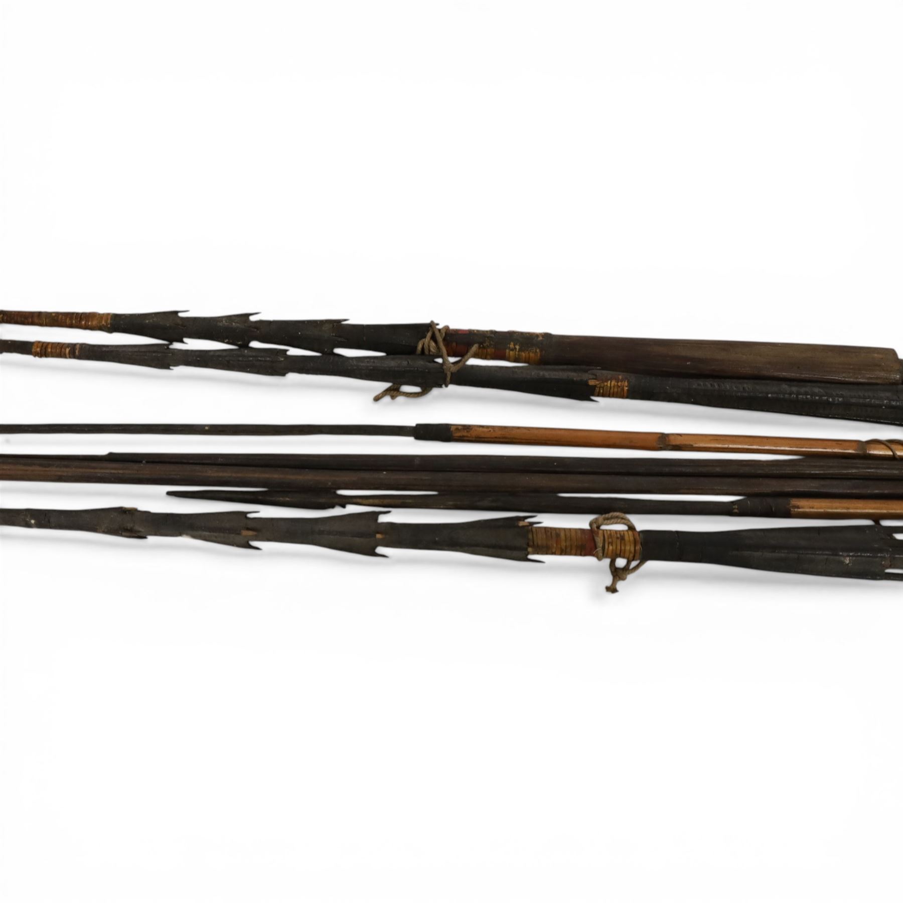 Papua New Guinea tribal fishing spears, together with carved boat 