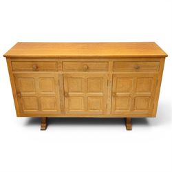 Beaverman - 1980s adzed oak sideboard raised on a trestle base, three drawers over three cupboards with Yorkshire Rose carved handles, fielded panelled sides and front, with carved Beaver, by Colin Almack of Sutton near Thirsk