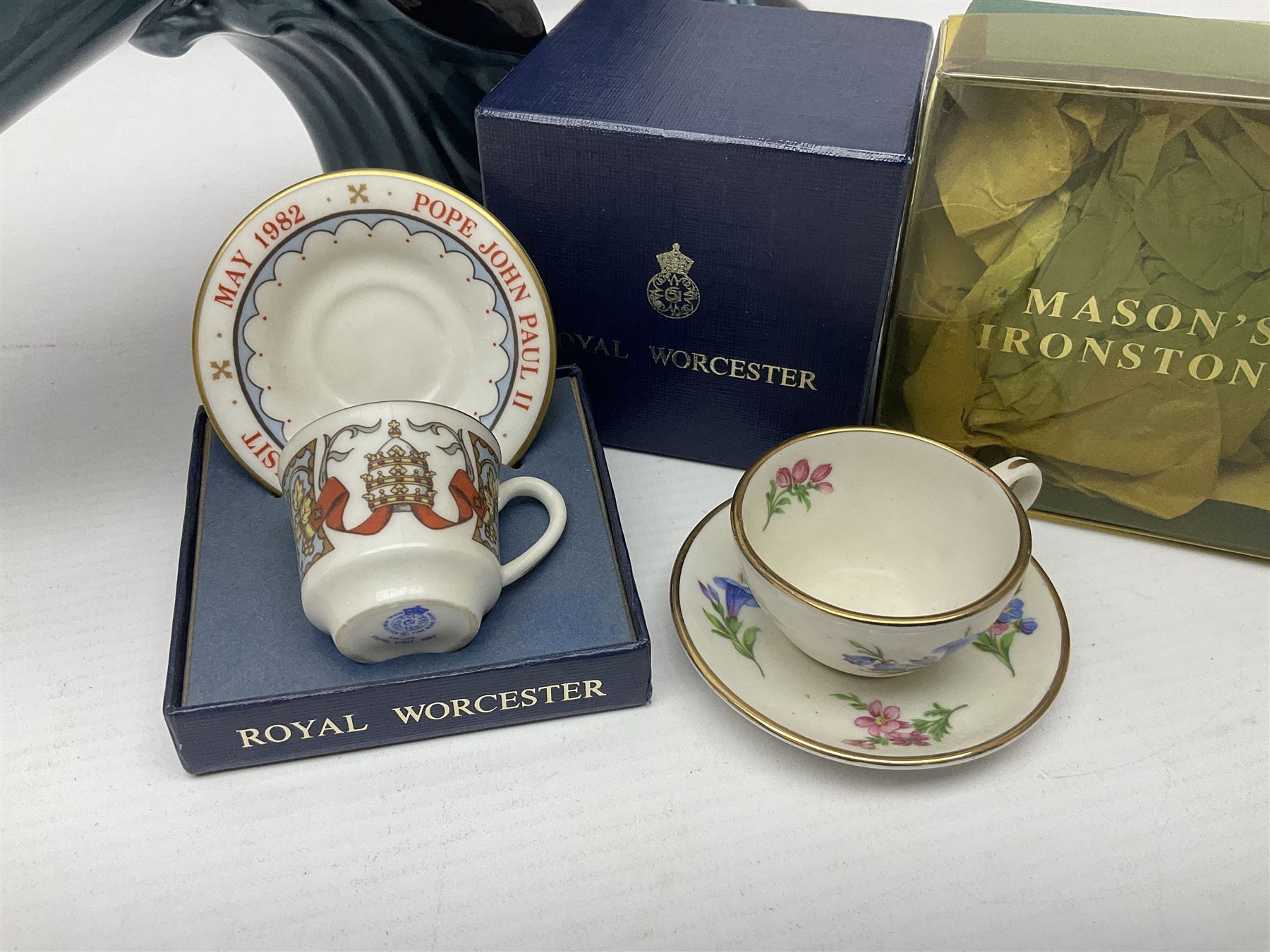 Poole pottery Dolphin, together with Royal Worcester miniature teacup and saucer, Royal Crown Derby miniature teacup and saucer in Derby Posies and one other