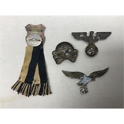 Imperial German Prussian Army Service Veterens Association badge; 'SS' type first pattern cap skull; Luftwaffe metal eagle uniform insignia; and another metal eagle cap insignia (possibly police?) (4)