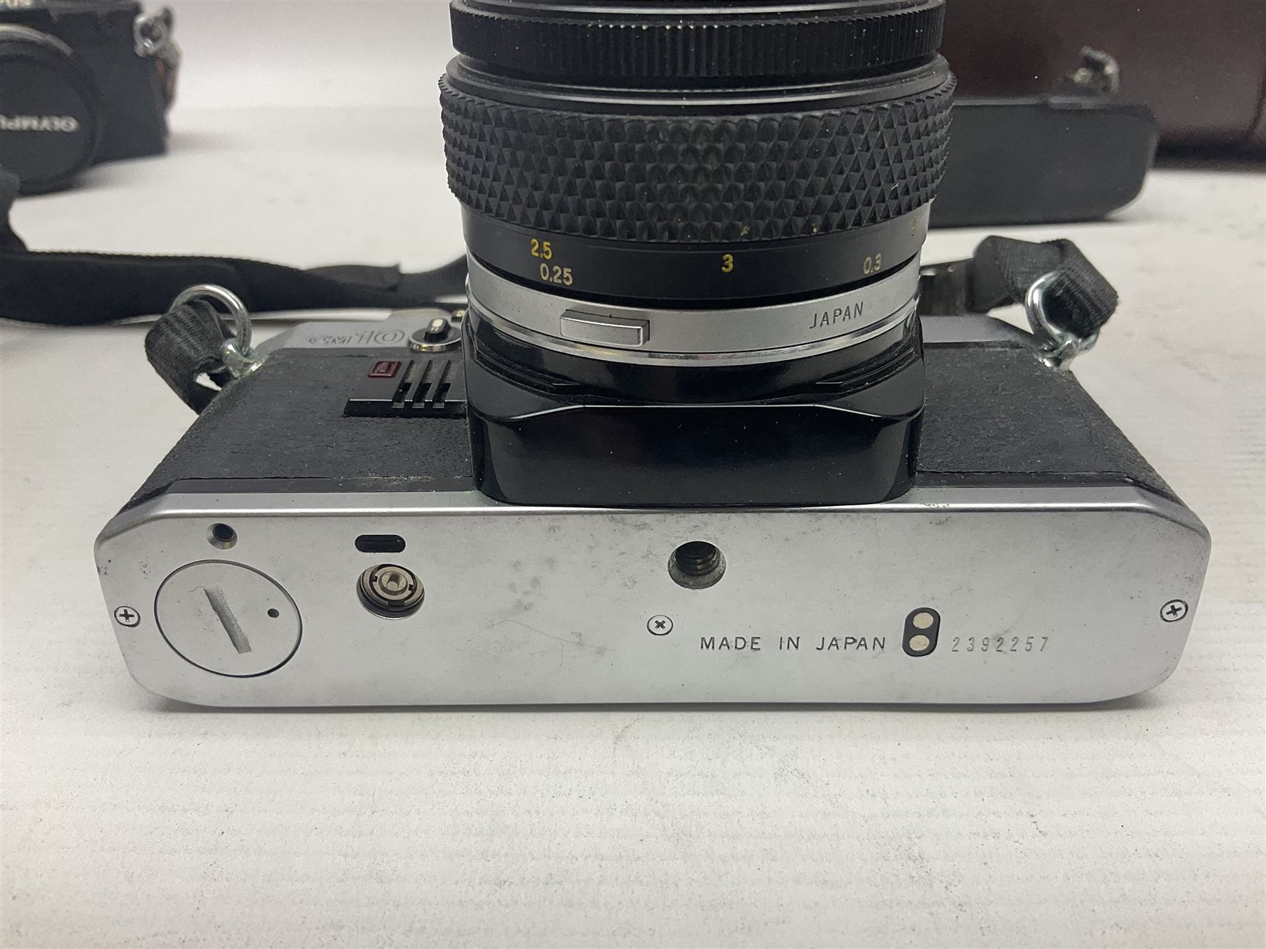 Olympus OM-2 camera body, serial no 1117526, with Olympus OM-System Zuiko Auto-W 28mm 1:2.8'  lens serial no 336591, Olympus OM10 camera body serial no 2392257, with Olympus OM-System Zuiko Auto-Macro 50mm 1:3.5' lens serial no 225784, Soligor C/D mirror lens 1:8 f=500mm' serial no 784035650 together with other camera equipment 